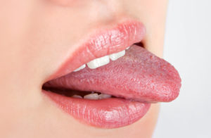 woman sticking out tongue